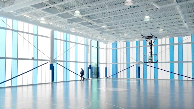 Eagle Academy in Washington, DC, features a translucent skin that allows controlled daylight to penetrate into the building’s interior during the day. At night, it provides a distinctive soft glow.